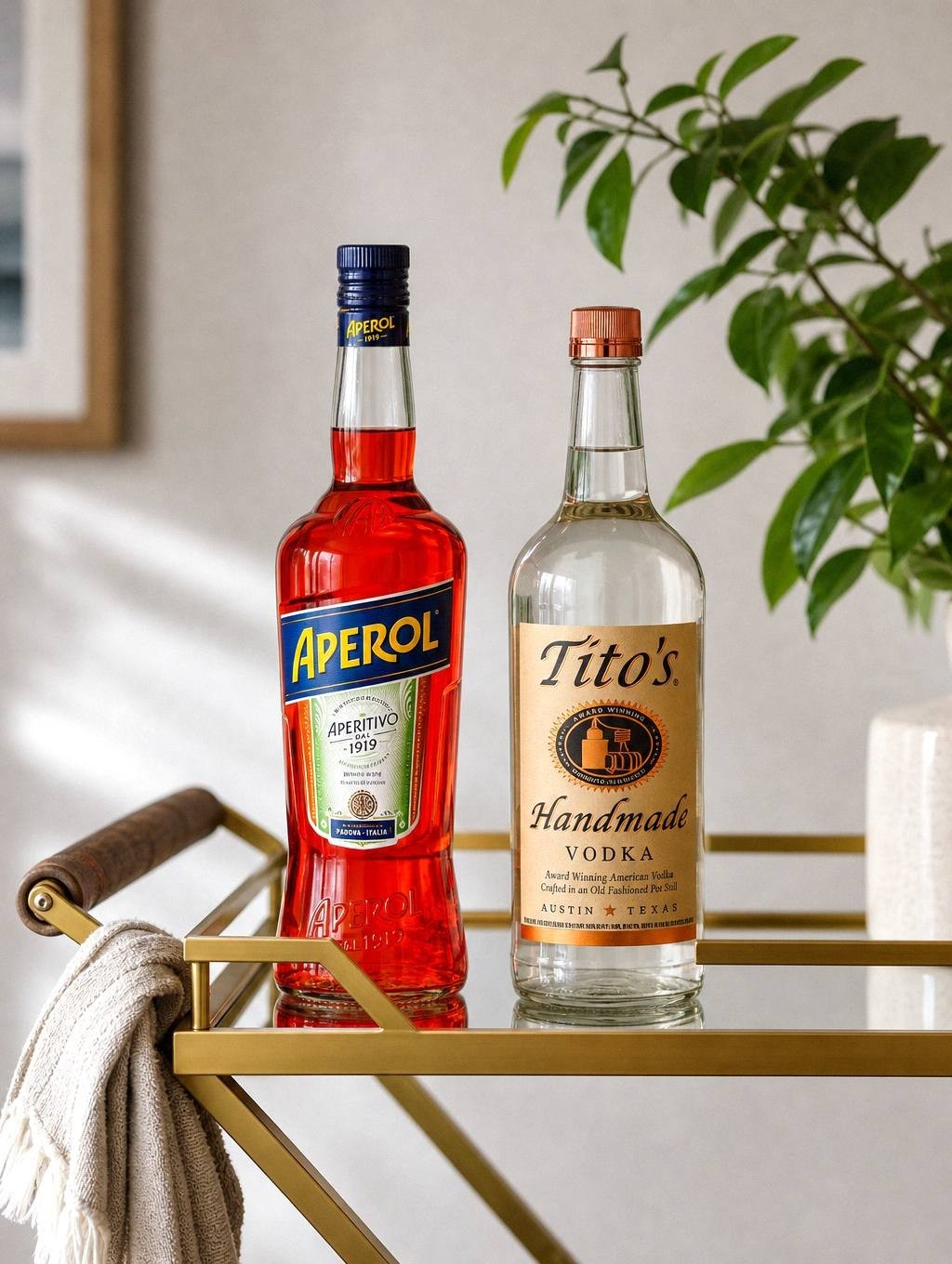 narrow black three-tier bar cart wedged between a kitchen counter and a wall on a hardwood floor