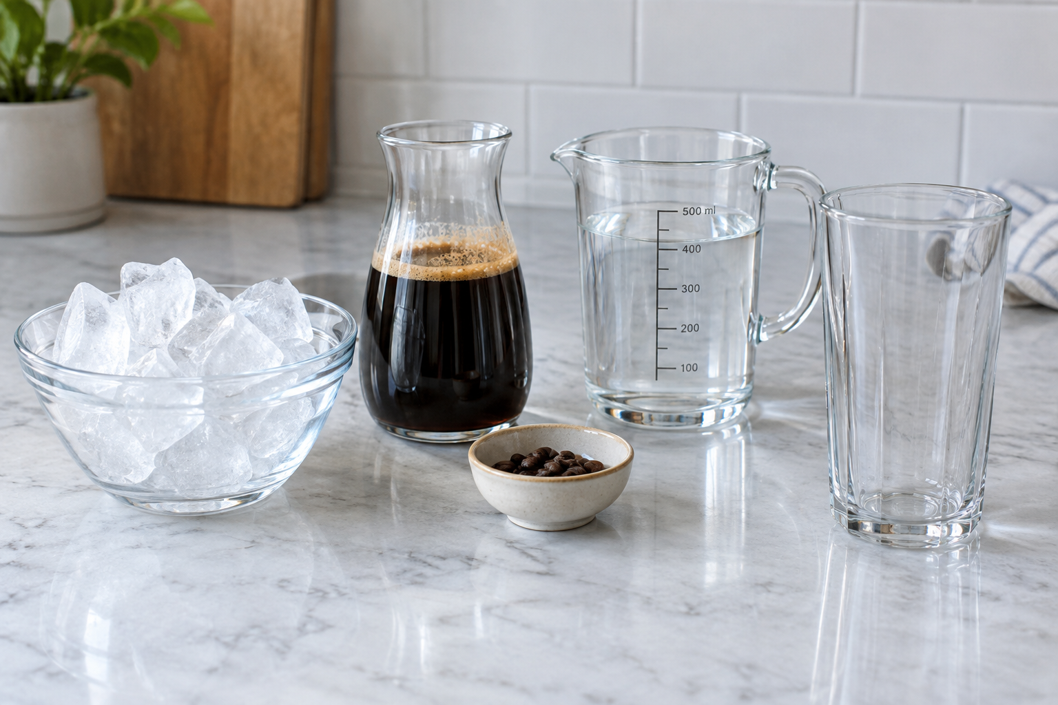 Ingredients for iced americano: ice cubes, espresso shot, and cold water measured in separate containers